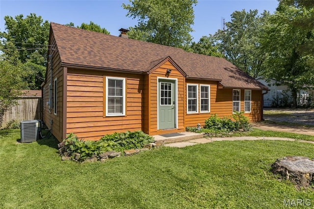 1158 Mulberry St, Bismarck, MO 63624 - bungalow-style house featuring central AC unit, a shingled roof, and a chimney