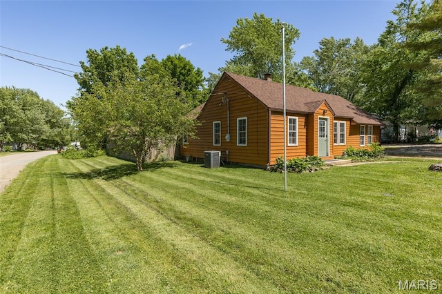 1158 Mulberry St, Bismarck, MO 63624 - view of home's exterior with central air condition unit and a lawn