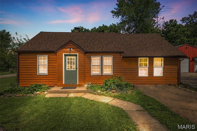1158 Mulberry St, Bismarck, MO 63624 - bungalow-style home featuring a chimney, a lawn, and roof with shingles