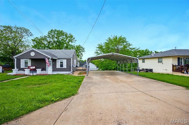 402 N 11th St, De Soto, MO 63020 - view of front facade with a carport, concrete driveway, covered porch, and a front lawn