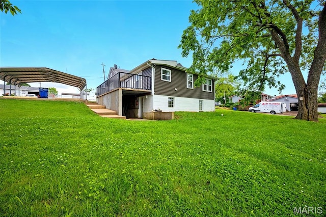 402 N 11th St, De Soto, MO 63020 - back of property featuring a carport, a lawn, and a deck
