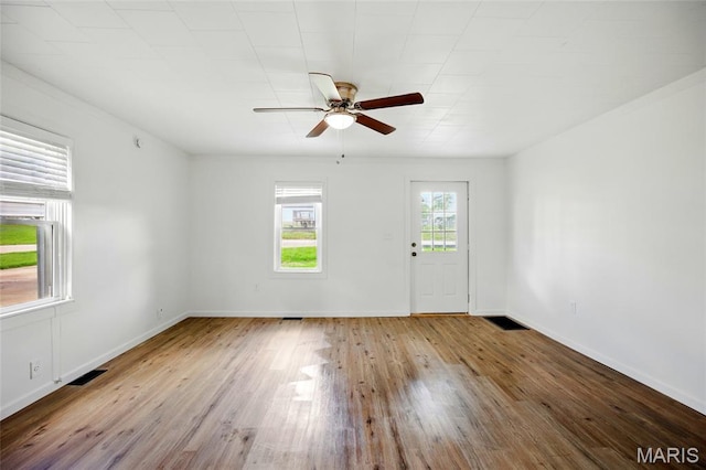 402 N 11th St, De Soto, MO 63020 - unfurnished room with a ceiling fan, wood finished floors, and baseboards