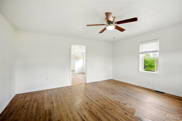 402 N 11th St, De Soto, MO 63020 - spare room with ornamental molding, hardwood / wood-style flooring, ceiling fan, and baseboards