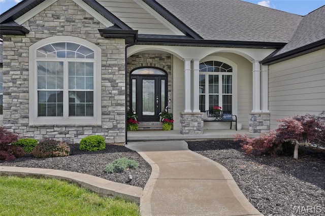 2 Mahogany Run, Farmington, MO 63640 - entrance to property featuring stone siding, covered porch, and roof with shingles