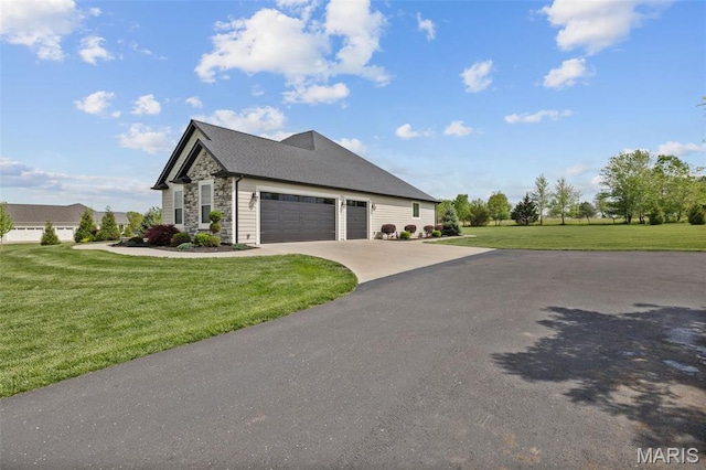 2 Mahogany Run, Farmington, MO 63640 - view of property exterior with stone siding, a lawn, a garage, and driveway