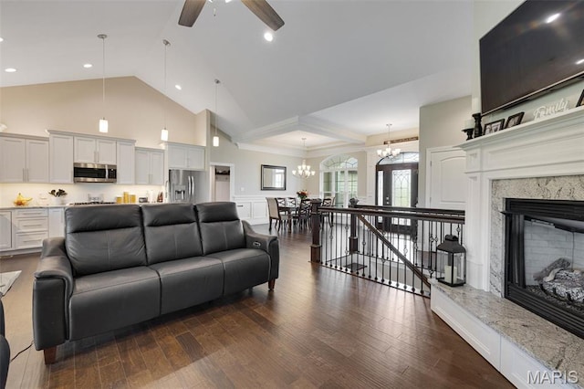 2 Mahogany Run, Farmington, MO 63640 - living area featuring ceiling fan, a chandelier, dark wood-type flooring, high vaulted ceiling, and a fireplace