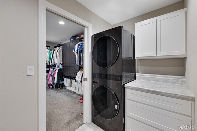2 Mahogany Run, Farmington, MO 63640 - washroom featuring stacked washer / dryer, cabinet space, carpet floors, and recessed lighting