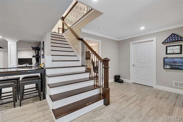2 Mahogany Run, Farmington, MO 63640 - stairway with baseboards, wood finished floors, ornate columns, ornamental molding, and recessed lighting