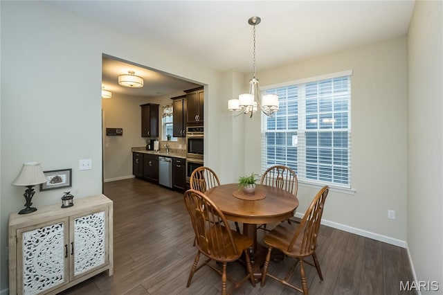 17006 Main St, Wildwood, MO 63040 - dining room featuring a chandelier, baseboards, dark wood-type flooring, and plenty of natural light