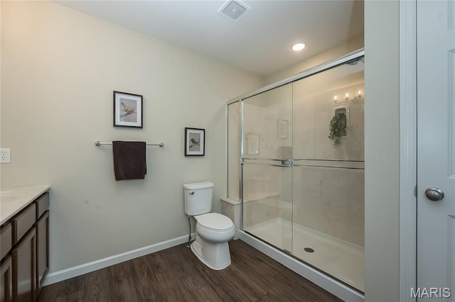 17006 Main St, Wildwood, MO 63040 - full bathroom featuring toilet, wood finished floors, a stall shower, and vanity