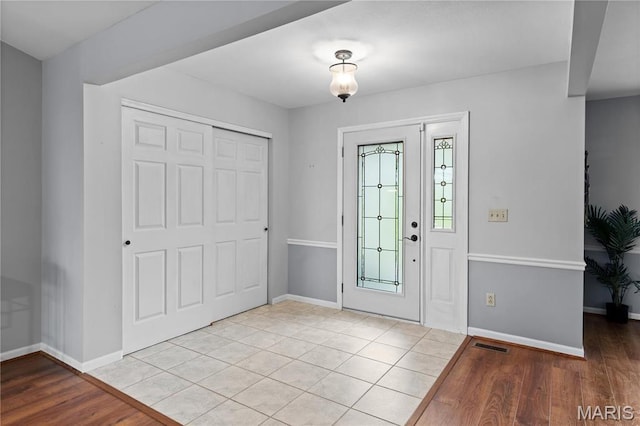 827 Bridgewater Xing, Villa Ridge, MO 63089 - foyer featuring baseboards and wood finished floors
