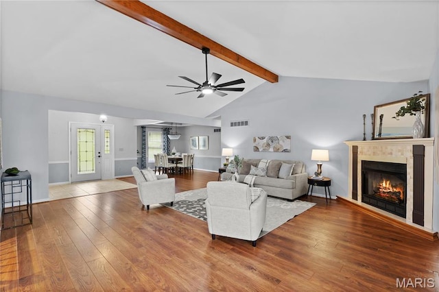 827 Bridgewater Xing, Villa Ridge, MO 63089 - living area featuring ceiling fan, a glass covered fireplace, and hardwood / wood-style flooring