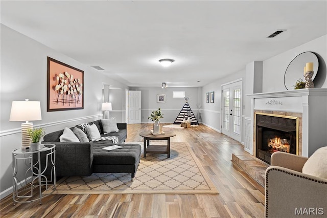 827 Bridgewater Xing, Villa Ridge, MO 63089 - living area with wood finished floors and a tiled fireplace