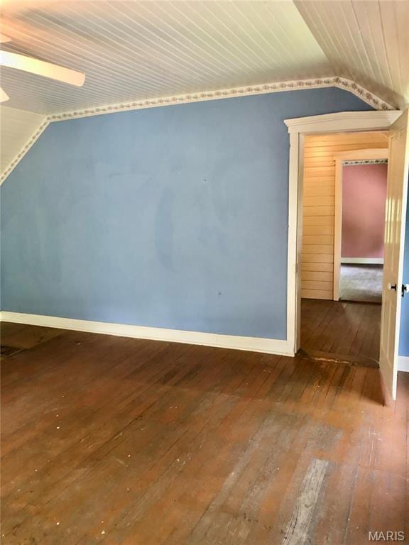 additional living space featuring lofted ceiling, hardwood / wood-style flooring, baseboards, and wooden ceiling