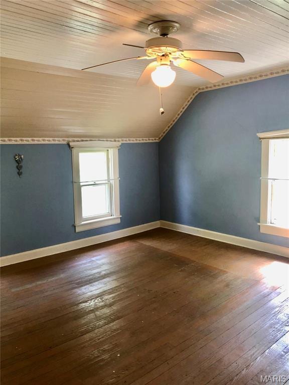 bonus room featuring lofted ceiling, wood ceiling, ceiling fan, dark wood-type flooring, and baseboards