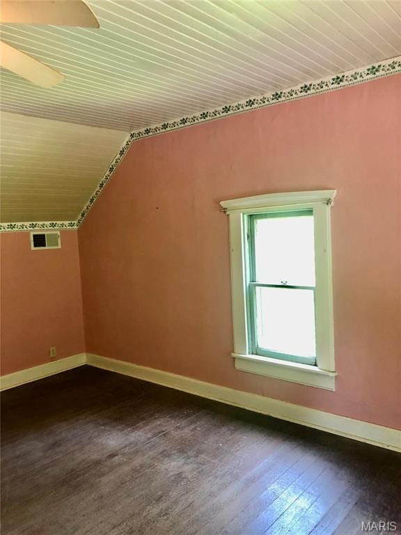 bonus room featuring dark wood finished floors, baseboards, wood ceiling, and lofted ceiling