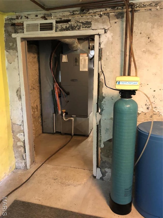 utility room with heating unit