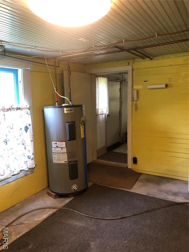 utility room featuring water heater