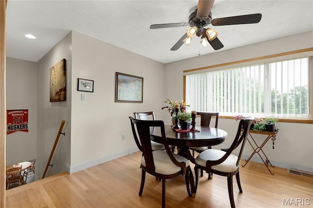 1261 Whispering Winds Dr, Arnold, MO 63010 - dining area featuring light wood finished floors, a ceiling fan, and recessed lighting