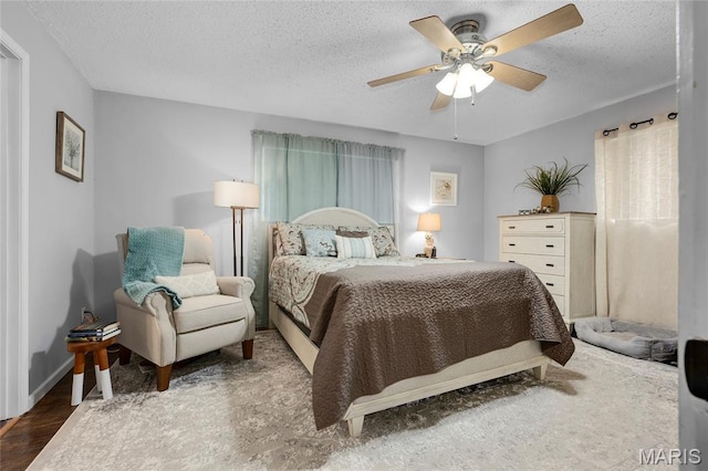 1261 Whispering Winds Dr, Arnold, MO 63010 - bedroom with a textured ceiling, wood finished floors, and ceiling fan