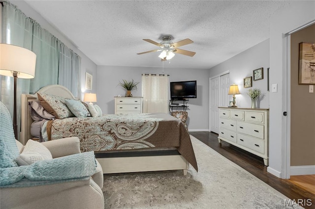 1261 Whispering Winds Dr, Arnold, MO 63010 - bedroom with wood finished floors, a textured ceiling, a ceiling fan, and a closet