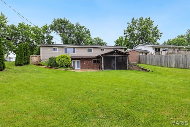 1261 Whispering Winds Dr, Arnold, MO 63010 - back of house with a sunroom, a shed, and brick siding