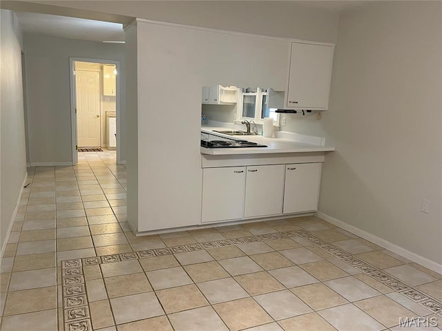 408 Crestview St, Cuba, MO 65453 - kitchen with a sink, light countertops, white cabinetry, and light tile patterned floors