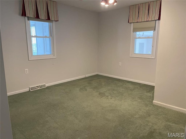 408 Crestview St, Cuba, MO 65453 - unfurnished room featuring dark carpet, plenty of natural light, and baseboards