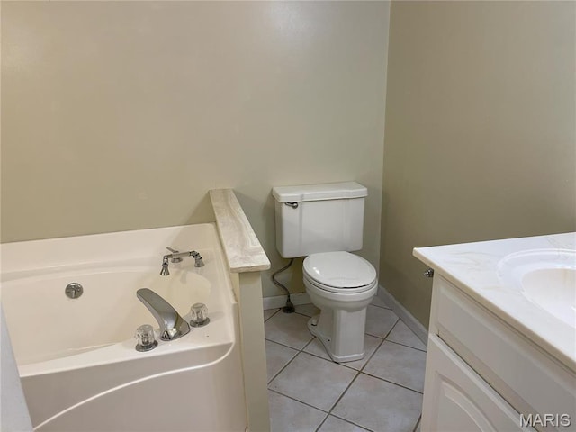 408 Crestview St, Cuba, MO 65453 - bathroom featuring toilet, a garden tub, vanity, tile patterned flooring, and baseboards