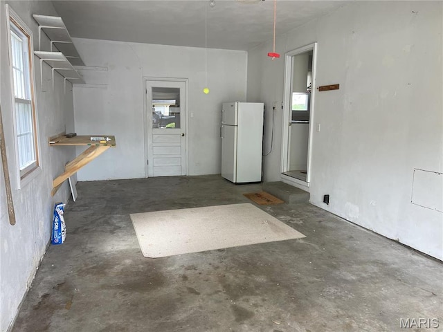 408 Crestview St, Cuba, MO 65453 - garage featuring freestanding refrigerator