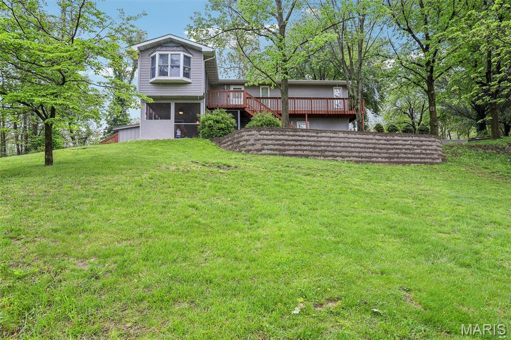 15 Kyle Dr, Collinsville, IL 62234 - rear view of property with a deck and a yard