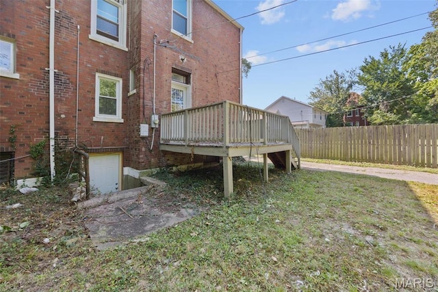 view of yard with fence and a deck