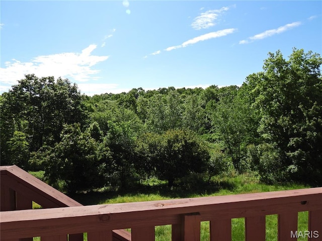 view of yard featuring a forest view