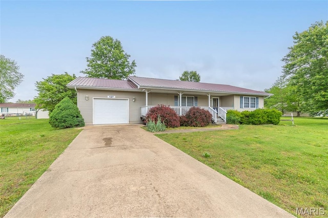 127 Chippewa, Piedmont, MO 63957 - single story home with a garage, a porch, a front yard, driveway, and metal roof