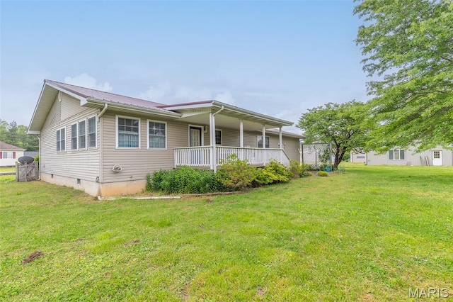 127 Chippewa, Piedmont, MO 63957 - view of front of home featuring a front lawn, metal roof, covered porch, and crawl space