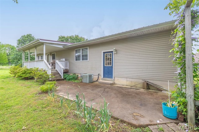 127 Chippewa, Piedmont, MO 63957 - rear view of property with central air condition unit, a lawn, a patio area, and a porch