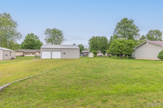 127 Chippewa, Piedmont, MO 63957 - view of green lawn featuring an outdoor structure and a garage