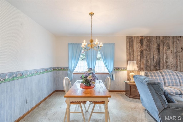 127 Chippewa, Piedmont, MO 63957 - carpeted dining space featuring a chandelier, wainscoting, and wood walls