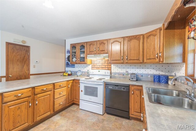 127 Chippewa, Piedmont, MO 63957 - kitchen with black dishwasher, white range with electric stovetop, a sink, under cabinet range hood, and brown cabinetry