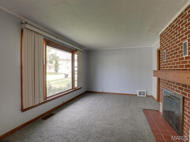 unfurnished living room featuring crown molding, a fireplace, dark carpet, and baseboards