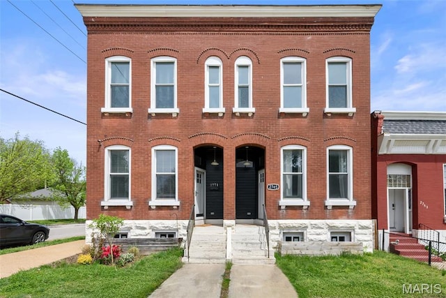 2765 Caroline St, Saint Louis, MO 63104 - townhome / multi-family property featuring brick siding