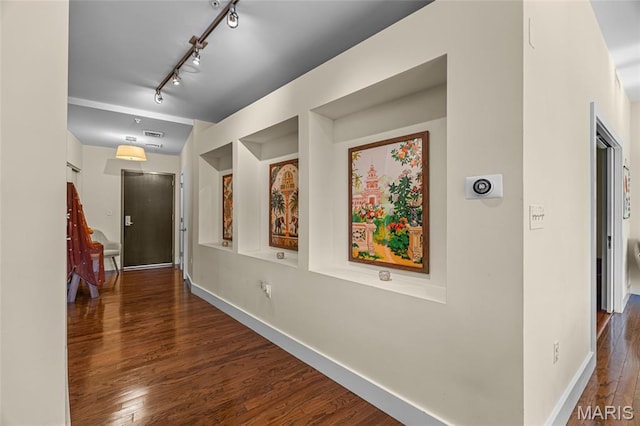 9 N Euclid Ave Unit 303, Saint Louis, MO 63108 - hall with wood finished floors, baseboards, and rail lighting