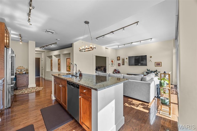 9 N Euclid Ave Unit 303, Saint Louis, MO 63108 - kitchen with track lighting, a sink, appliances with stainless steel finishes, open floor plan, and brown cabinets