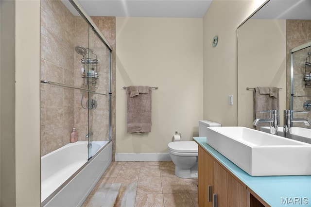 9 N Euclid Ave Unit 303, Saint Louis, MO 63108 - full bathroom featuring toilet, vanity, combined bath / shower with glass door, and baseboards