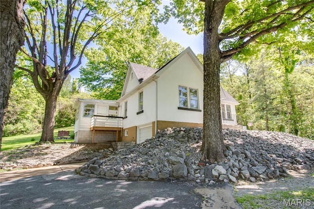 931 Sugarloaf Hill Rd, Dupo, IL 62239 - view of side of home with stucco siding and an attached garage