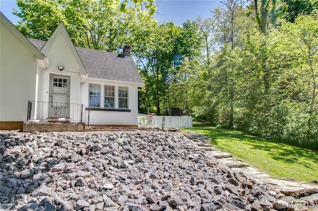 931 Sugarloaf Hill Rd, Dupo, IL 62239 - exterior space with a chimney, fence, and roof with shingles