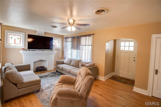 931 Sugarloaf Hill Rd, Dupo, IL 62239 - living area with arched walkways, ceiling fan, and plenty of natural light