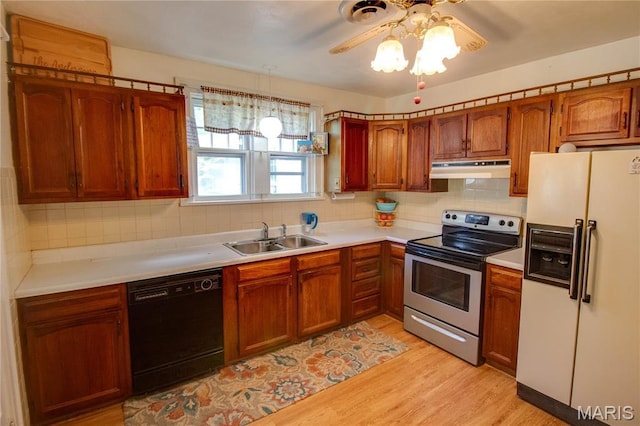 931 Sugarloaf Hill Rd, Dupo, IL 62239 - kitchen featuring white refrigerator with ice dispenser, stainless steel range with electric cooktop, dishwasher, a sink, and under cabinet range hood