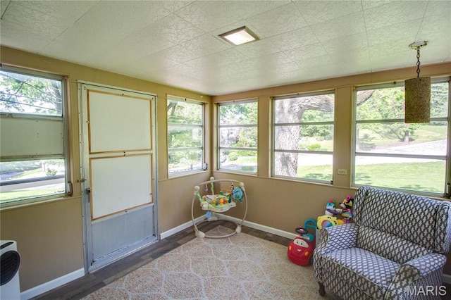 931 Sugarloaf Hill Rd, Dupo, IL 62239 - sunroom / solarium with wood finished floors, plenty of natural light, and baseboards