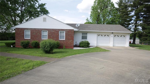 209 Highley Ln, Desloge, MO 63628 - view of front facade featuring an attached garage, driveway, a front yard, and brick siding